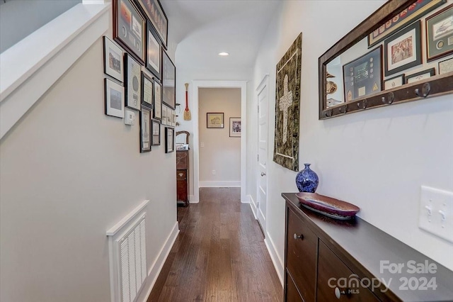 hallway with dark hardwood / wood-style floors