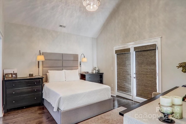 bedroom featuring high vaulted ceiling and dark wood-type flooring