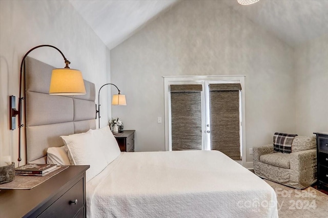 bedroom featuring high vaulted ceiling