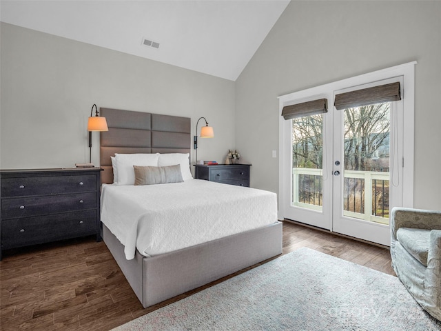 bedroom with dark wood-type flooring, access to outside, high vaulted ceiling, and french doors