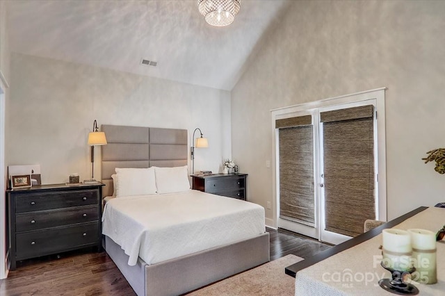 bedroom with access to outside, high vaulted ceiling, and dark hardwood / wood-style floors