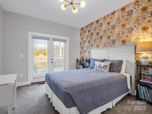 carpeted bedroom with french doors, a notable chandelier, and access to outside