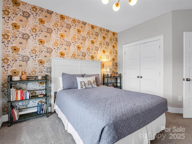 carpeted bedroom featuring a closet