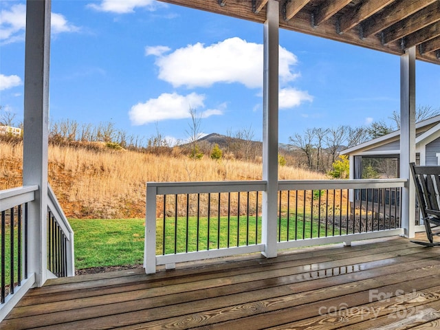 deck featuring a lawn