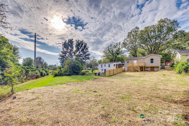 view of yard with a wooden deck