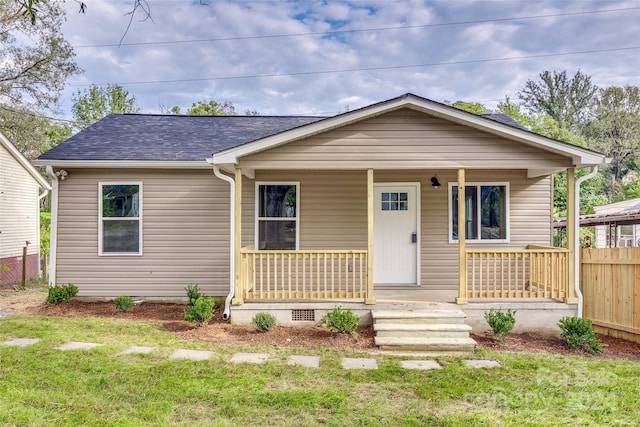 view of front of home featuring a front lawn and covered porch