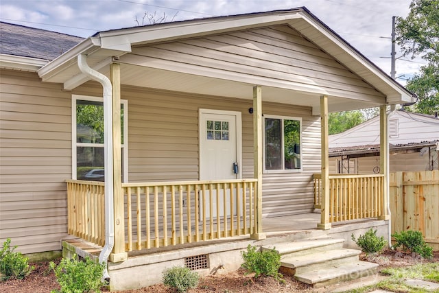 doorway to property featuring covered porch