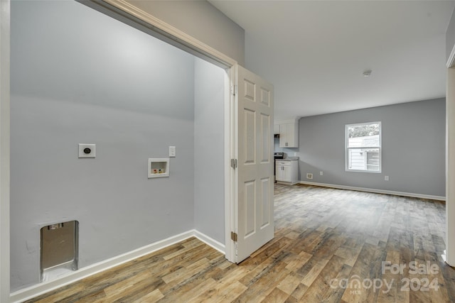 washroom featuring light hardwood / wood-style floors, electric dryer hookup, and hookup for a washing machine