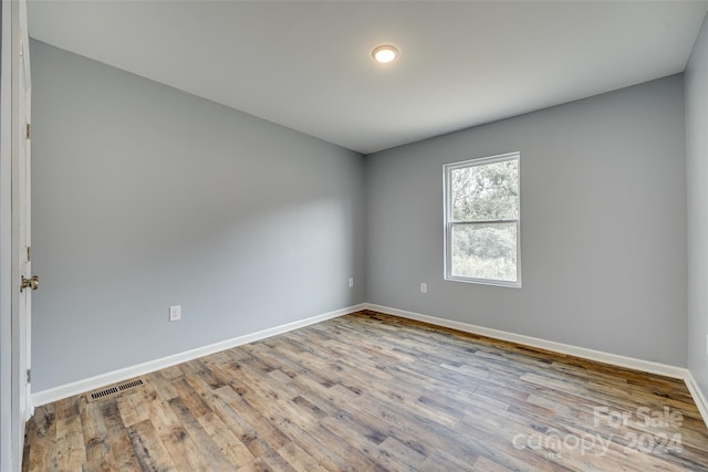 unfurnished room featuring light hardwood / wood-style flooring