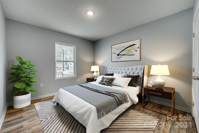 bedroom with hardwood / wood-style flooring