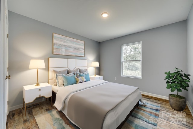 bedroom featuring hardwood / wood-style flooring