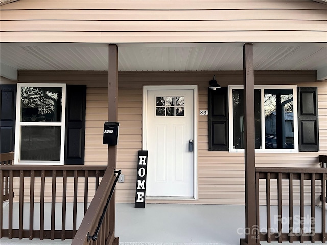 doorway to property with a porch