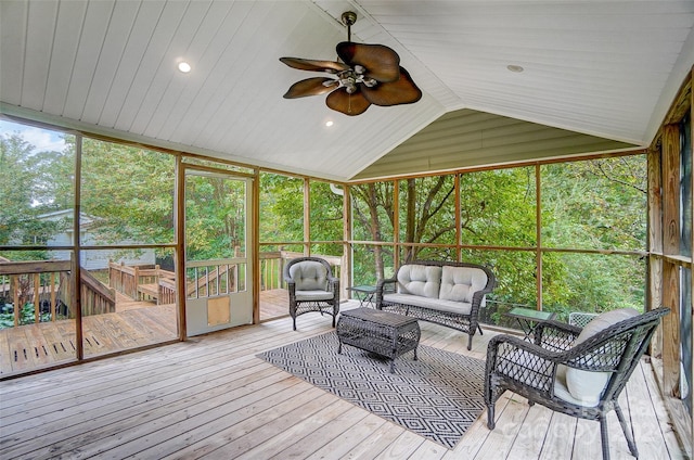 sunroom with wooden ceiling, vaulted ceiling, ceiling fan, and a healthy amount of sunlight