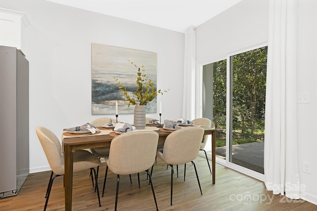 dining room with hardwood / wood-style flooring