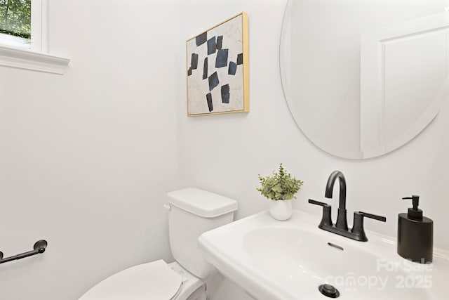 bathroom with toilet and sink