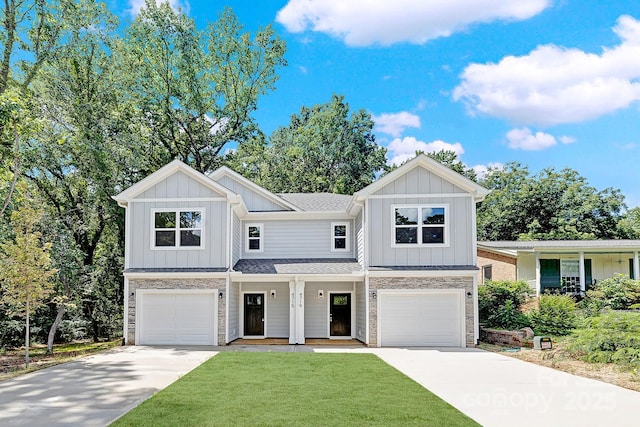 view of front of property with a garage and a front yard