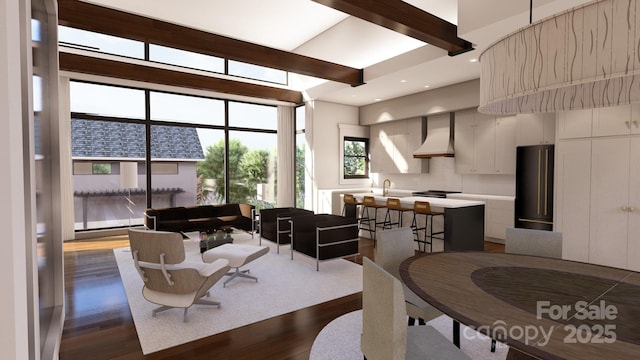 dining area featuring beamed ceiling and dark hardwood / wood-style floors