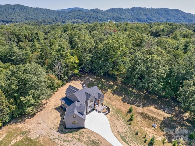 birds eye view of property with a mountain view