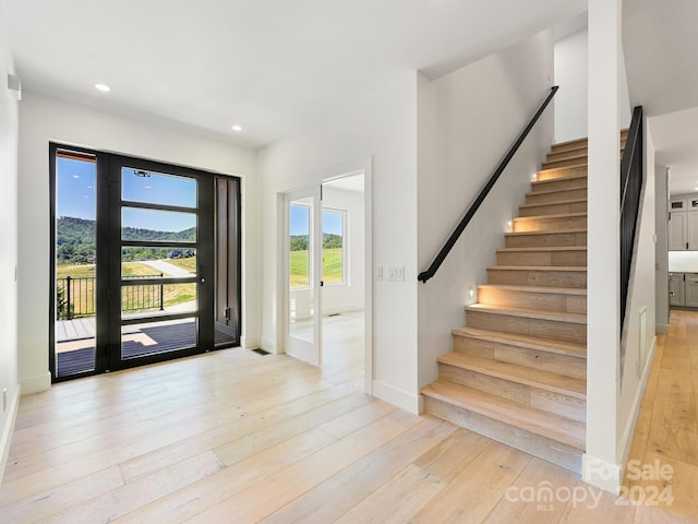 foyer with light wood-type flooring