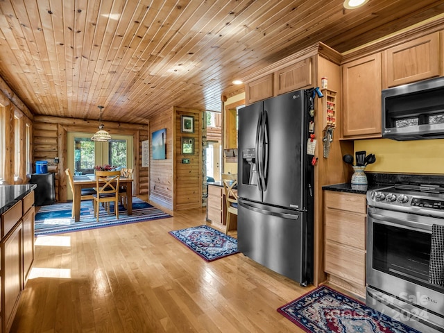 181 Highland Hts, Lake Lure, NC 28746 - kitchen featuring appliances with stainless steel finishes, wood ceiling, light wood-type flooring, rustic walls, and pendant lighting