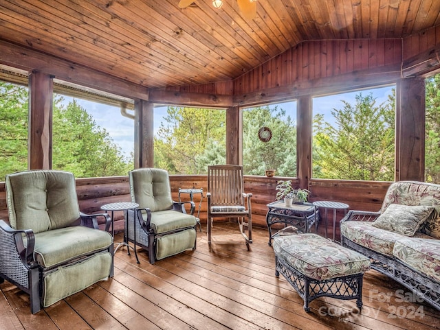 sunroom featuring vaulted ceiling, ceiling fan, and wooden ceiling