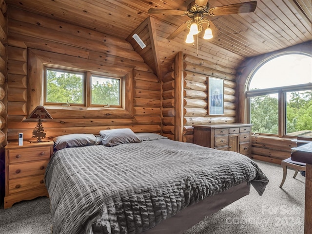 bedroom featuring wooden ceiling, log walls, ceiling fan, and carpet floors