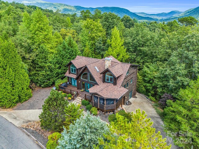 181 Highland Hts, Lake Lure, NC 28746 - view of subject property with a heavily wooded area and a mountain backdrop
