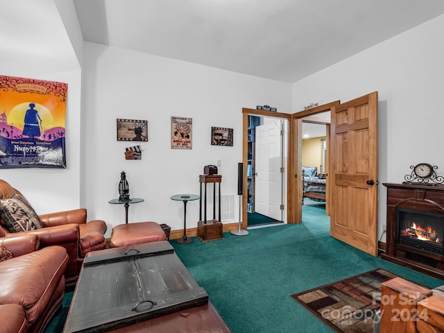 181 Highland Hts, Lake Lure, NC 28746 - living area featuring carpet, a glass covered fireplace, and baseboards