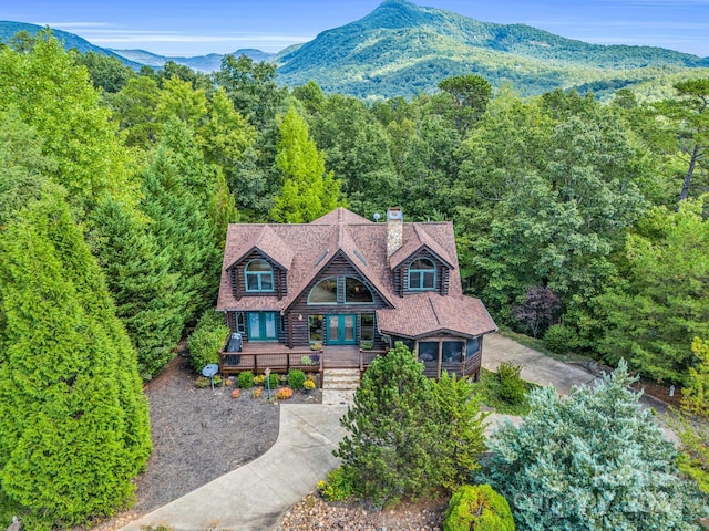 view of front facade with a deck with mountain view