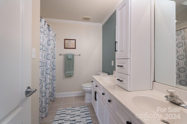 bathroom featuring ornamental molding, vanity, toilet, and tile patterned floors