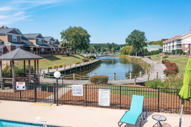 surrounding community featuring a gazebo and a water view