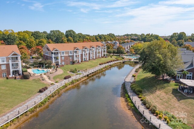 birds eye view of property featuring a water view