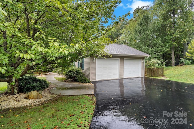 garage with a lawn