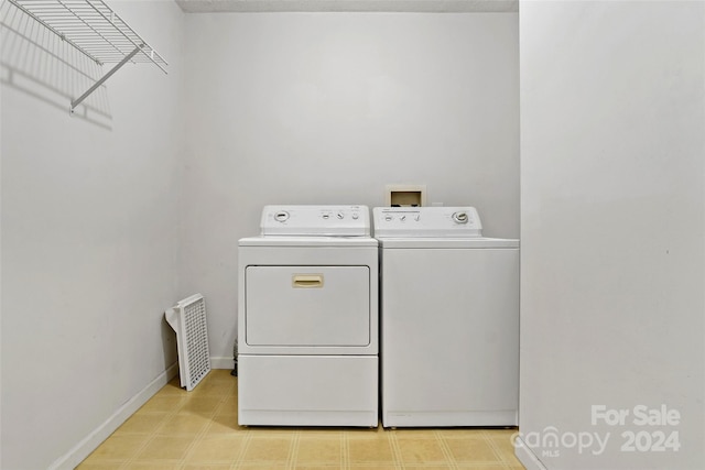 laundry area featuring washing machine and clothes dryer