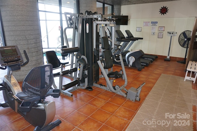 workout area with tile patterned floors