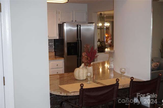 dining room with a notable chandelier