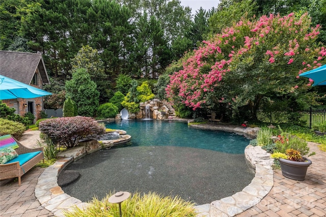 view of pool featuring a patio area and pool water feature