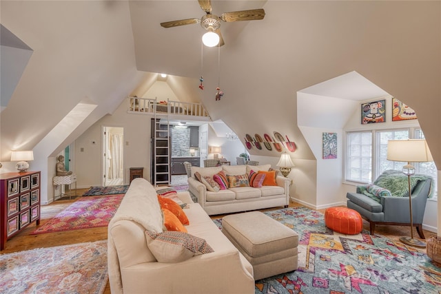 living room with wood-type flooring, lofted ceiling, and ceiling fan