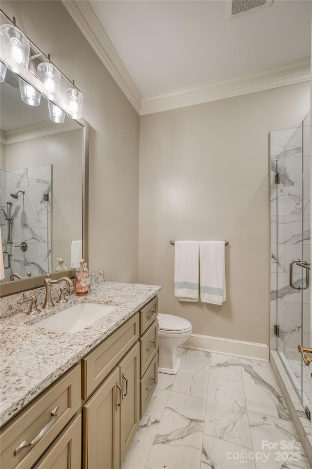 bathroom featuring marble finish floor, crown molding, a marble finish shower, vanity, and baseboards