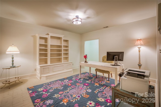 home office featuring visible vents and baseboards