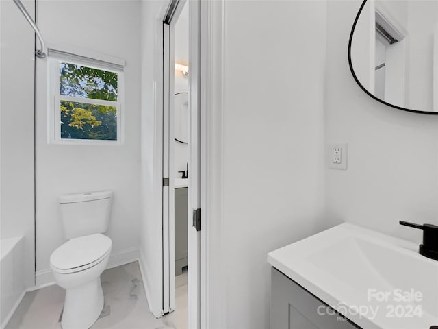 bathroom with vanity and toilet