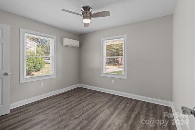 unfurnished room featuring dark wood finished floors, baseboards, a wall mounted AC, and ceiling fan