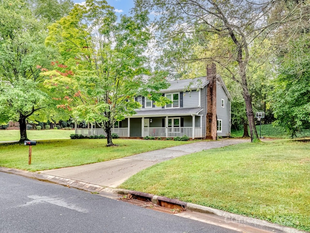 view of front facade with covered porch and a front yard