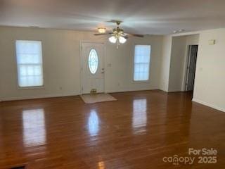 foyer with ceiling fan and dark hardwood / wood-style flooring