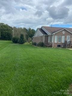 view of home's exterior with a yard