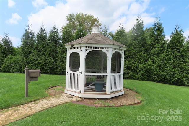 view of outdoor structure featuring a yard and a gazebo