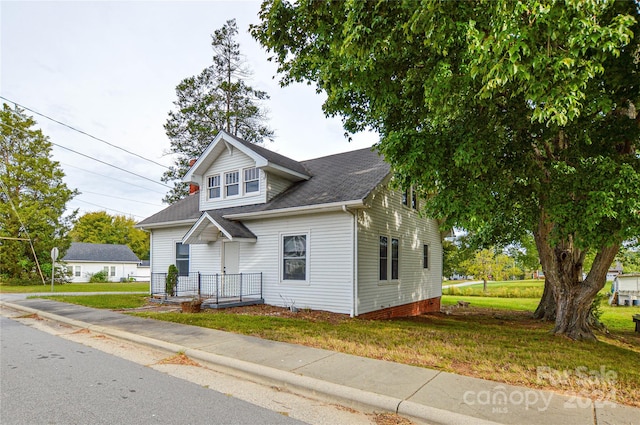 bungalow-style house with a front yard