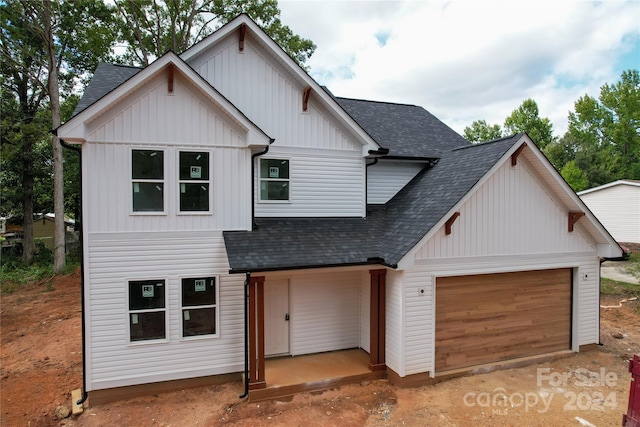 modern farmhouse style home featuring a garage