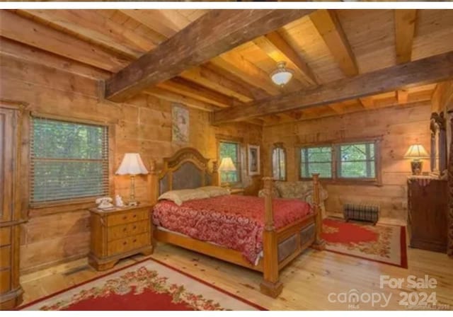 bedroom featuring light hardwood / wood-style flooring, wood ceiling, and beamed ceiling