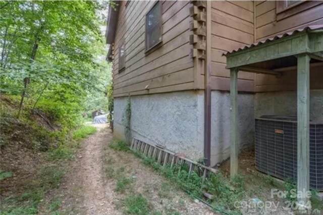 view of property exterior featuring central AC unit